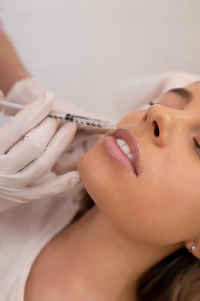 close-up-woman-getting-lip-filler-with-injection